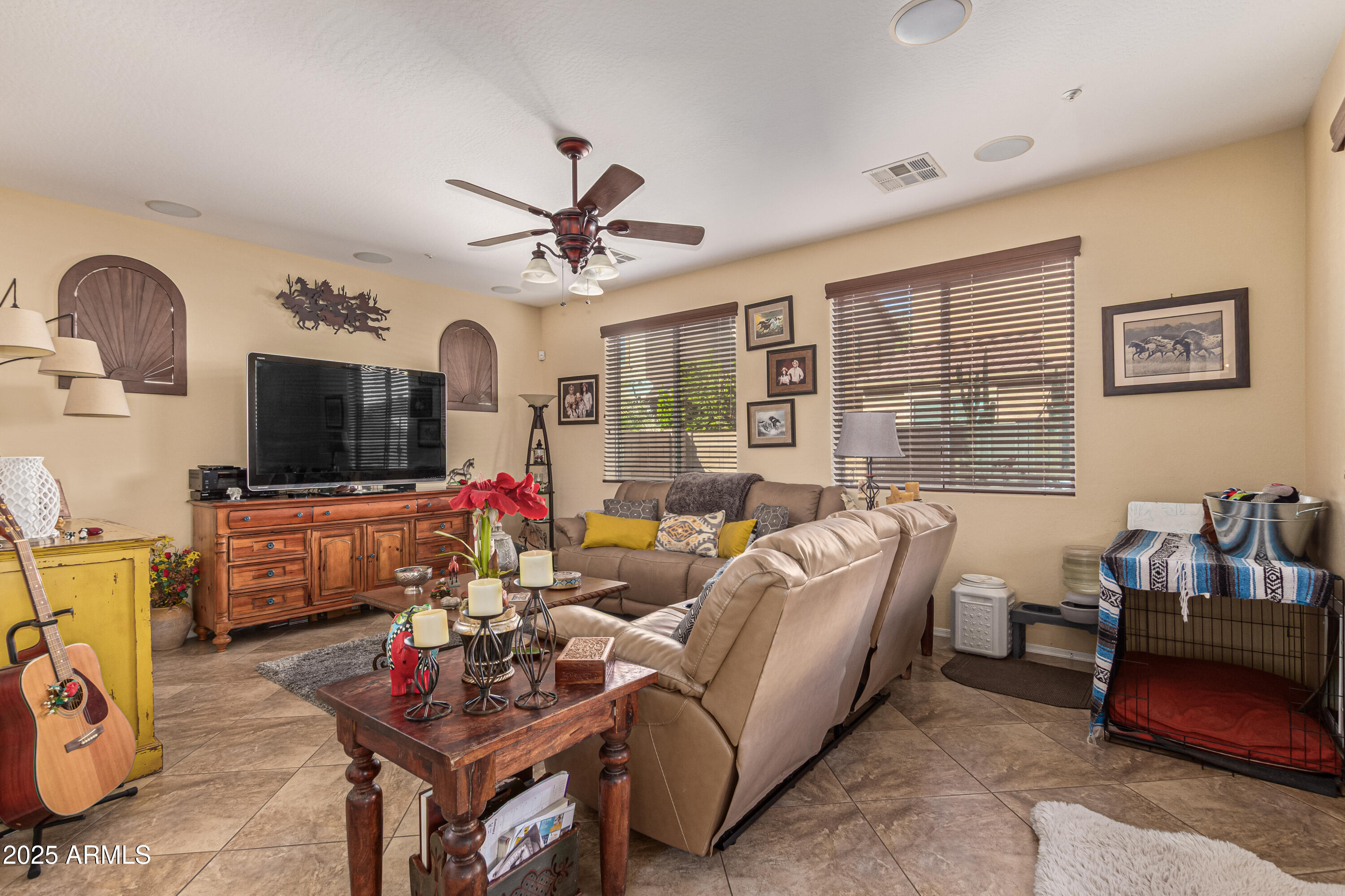 3238 East Ridgewood Lane Gilbert, AZ 85298 - Photo 6 of 43 a living room with furniture and a flat screen tv