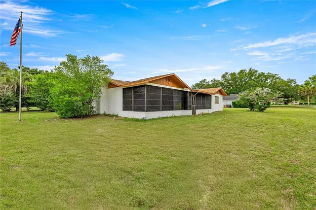 a view of a house with a big yard
