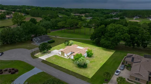 an aerial view of a house with a garden