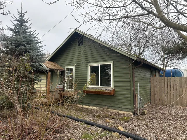 a house with trees in the background