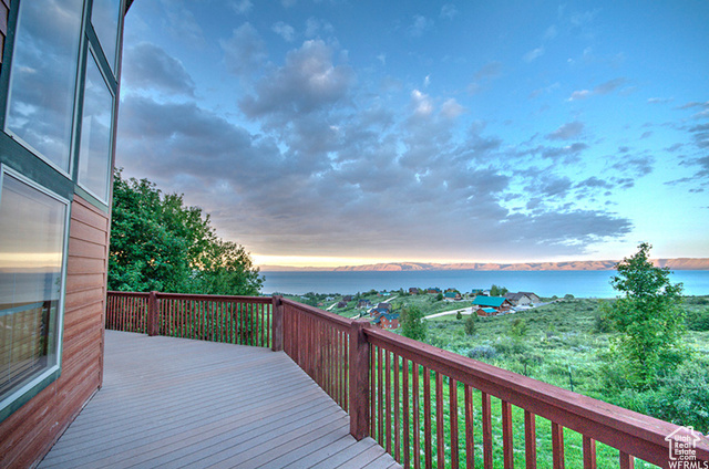 1340 Trapper Loop Garden City, UT 84028 - Photo 31 of 35 Deck at dusk featuring a water view