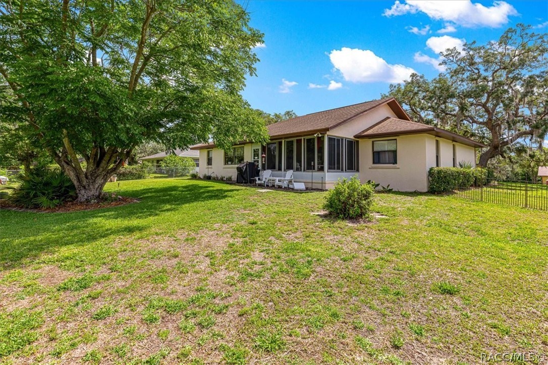 2964 South Cygnet Terrace Inverness, FL 34450 - Photo 51 of 67 a front view of house with yard and green space