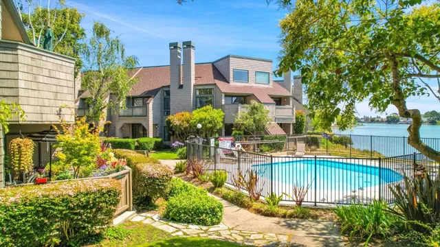 a view of a house with a yard and sitting area