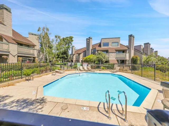 a view of a city with lawn chairs