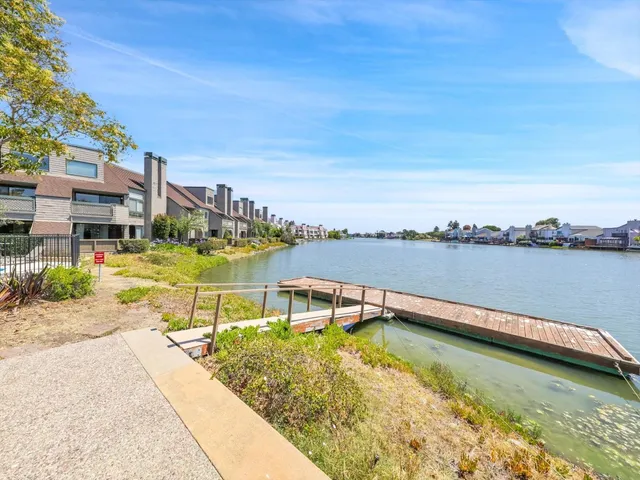 an aerial view of multiple houses with yard