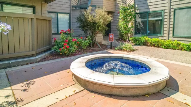 a view of a lake with a table and chairs