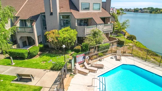 a view of kitchen with furniture and a living room