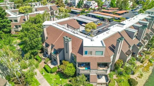 a view of a dining room with furniture wooden floor and a chandelier