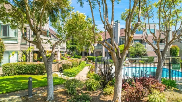 a kitchen with granite countertop a sink and cabinets