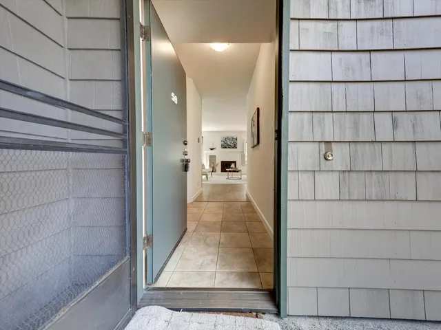 a large kitchen with stainless steel appliances granite countertop a sink and cabinets