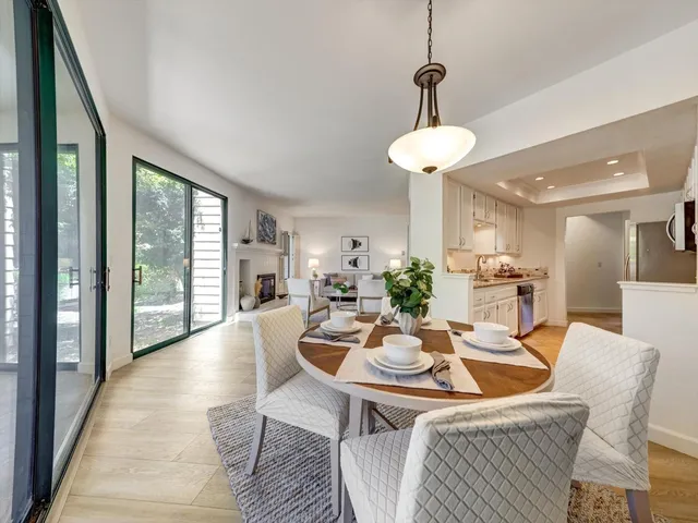 a bedroom with a large bed and a large window