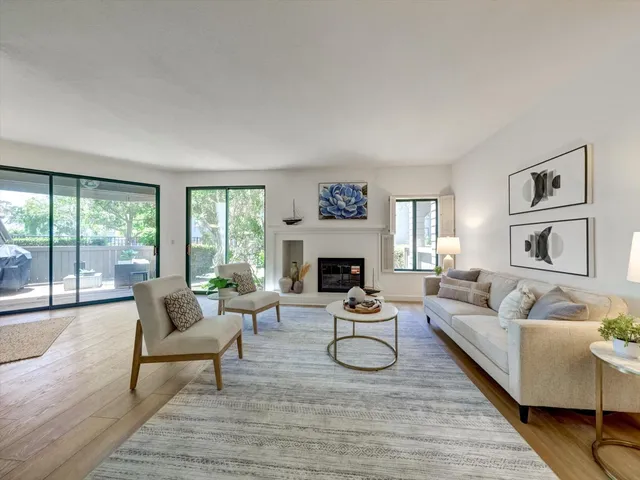 a bathroom with a granite countertop sink mirror and cabinets
