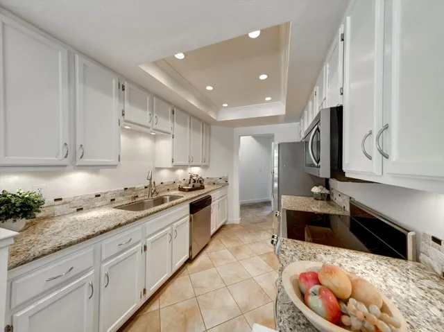 a bedroom with a bed and painting on the wall