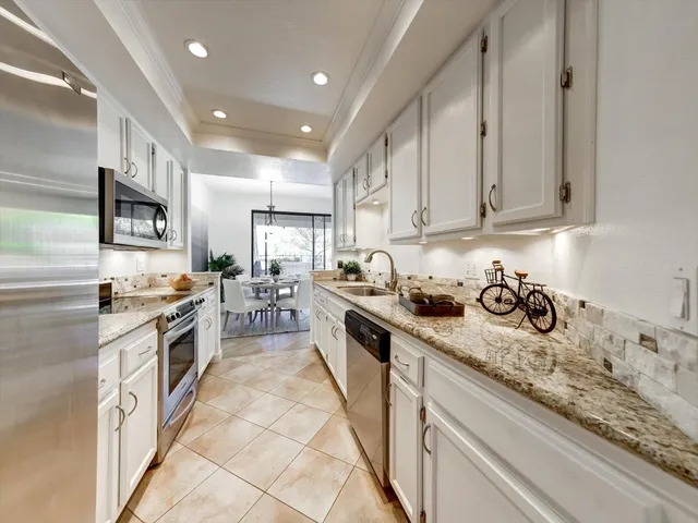 a bedroom with a bed and a lamp on table