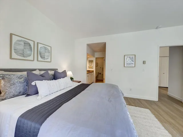 a view of a lake with a building and a big yard