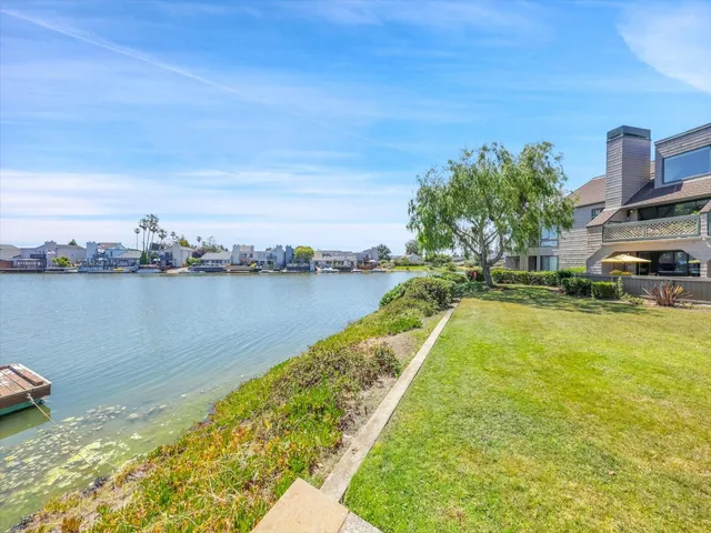 a view of swimming pool with outdoor seating and city view