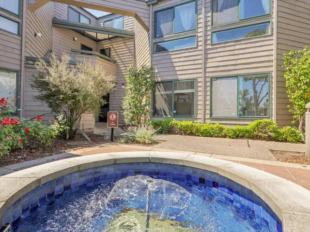 a view of a garden with a house