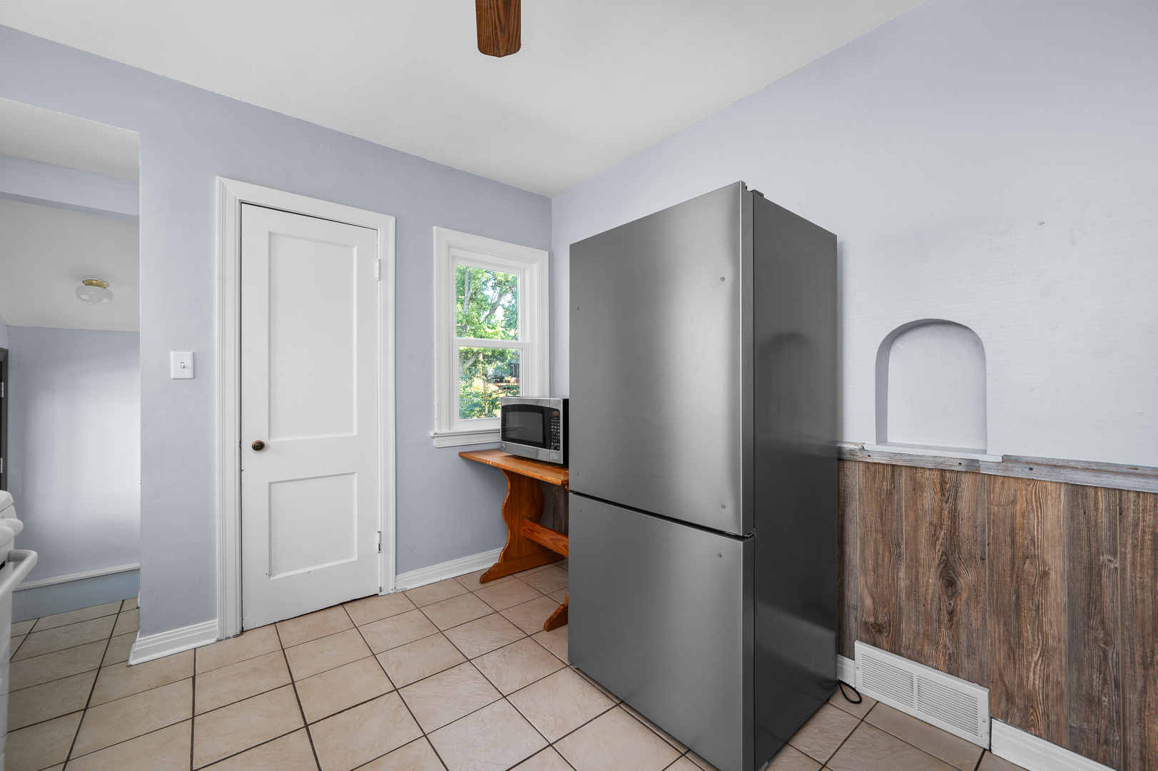 1619 20th Avenue Rock Island, IL 61201 - Photo 12 of 24 a kitchen with a refrigerator and cabinets