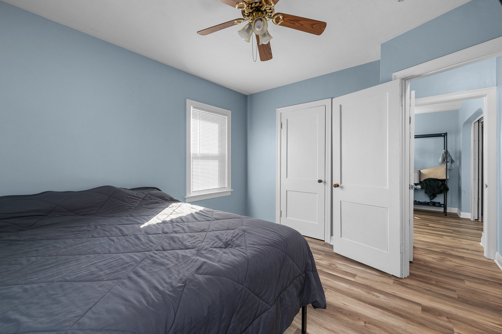 1619 20th Avenue Rock Island, IL 61201 - Photo 14 of 24 a bedroom with a bed and a chandelier