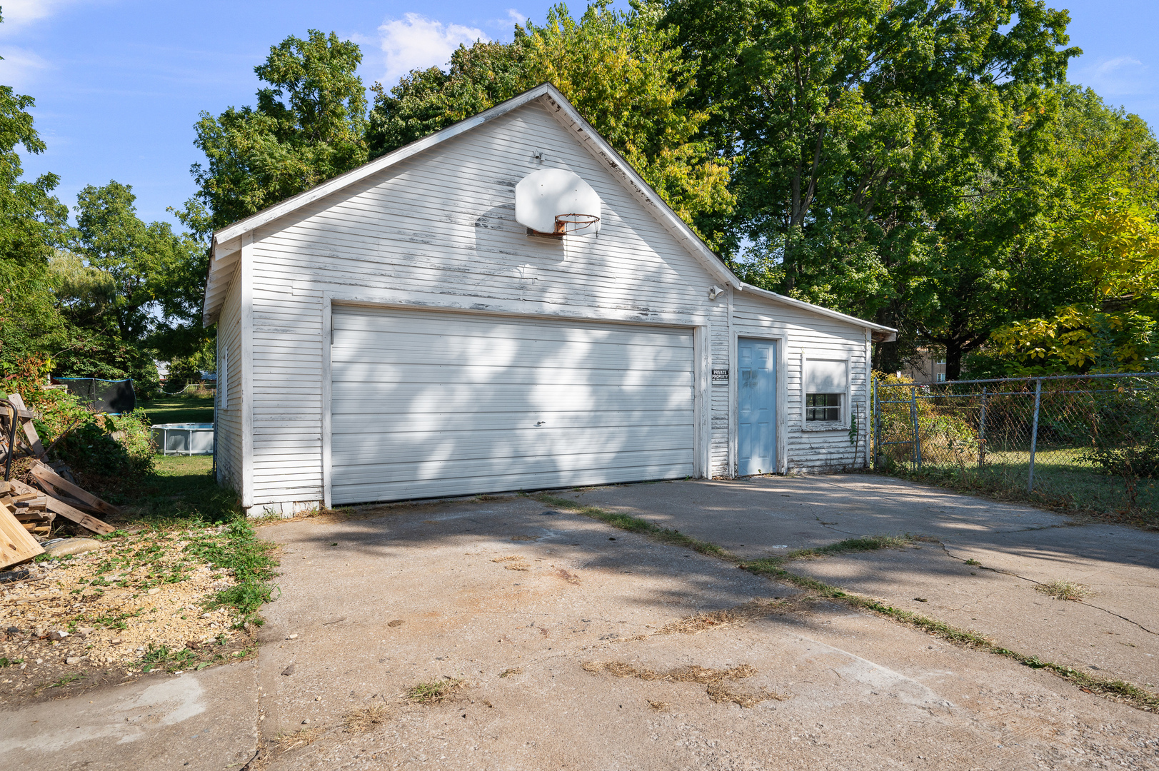 1619 20th Avenue Rock Island, IL 61201 - Photo 21 of 24 a view of a small yard in front of a house with large trees
