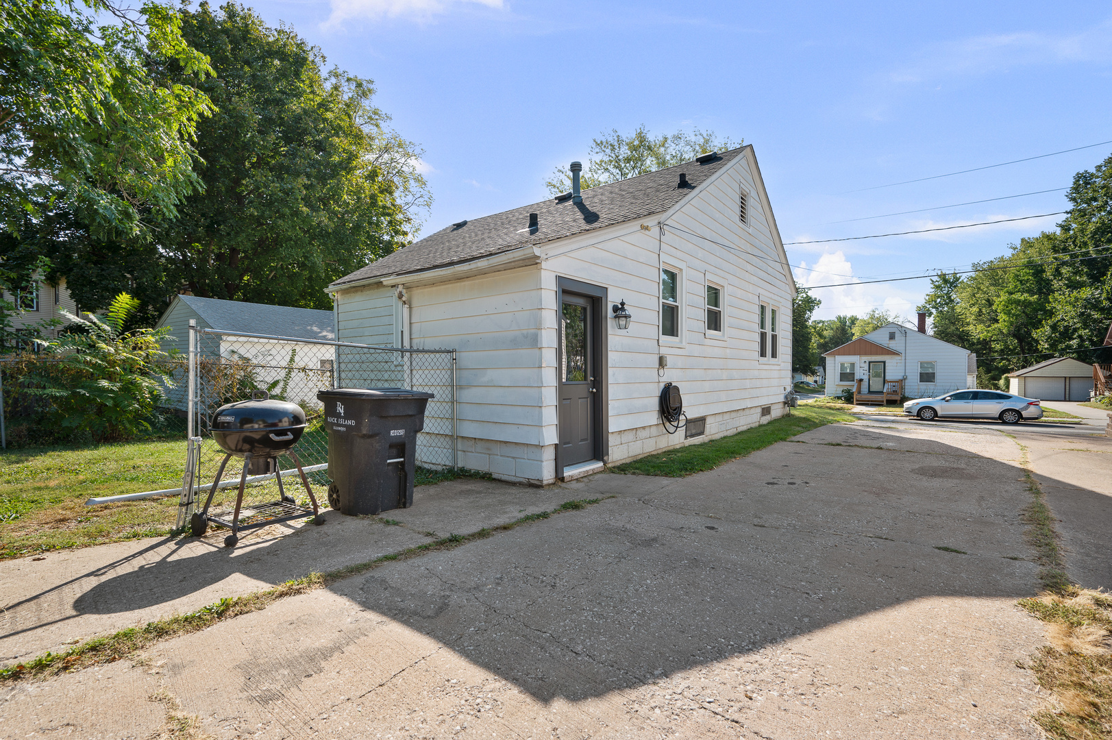 1619 20th Avenue Rock Island, IL 61201 - Photo 22 of 24 a view of a patio with table and chairs near a yard