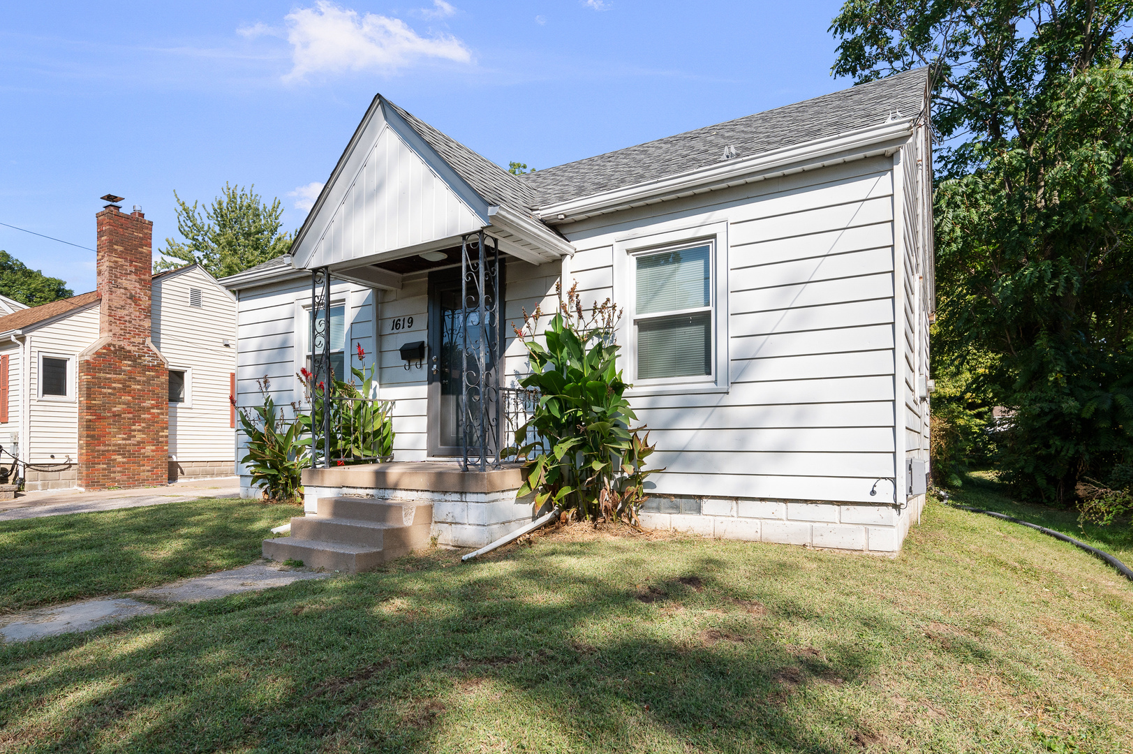 1619 20th Avenue Rock Island, IL 61201 - Photo 24 of 24 a view of a house with a yard and plants