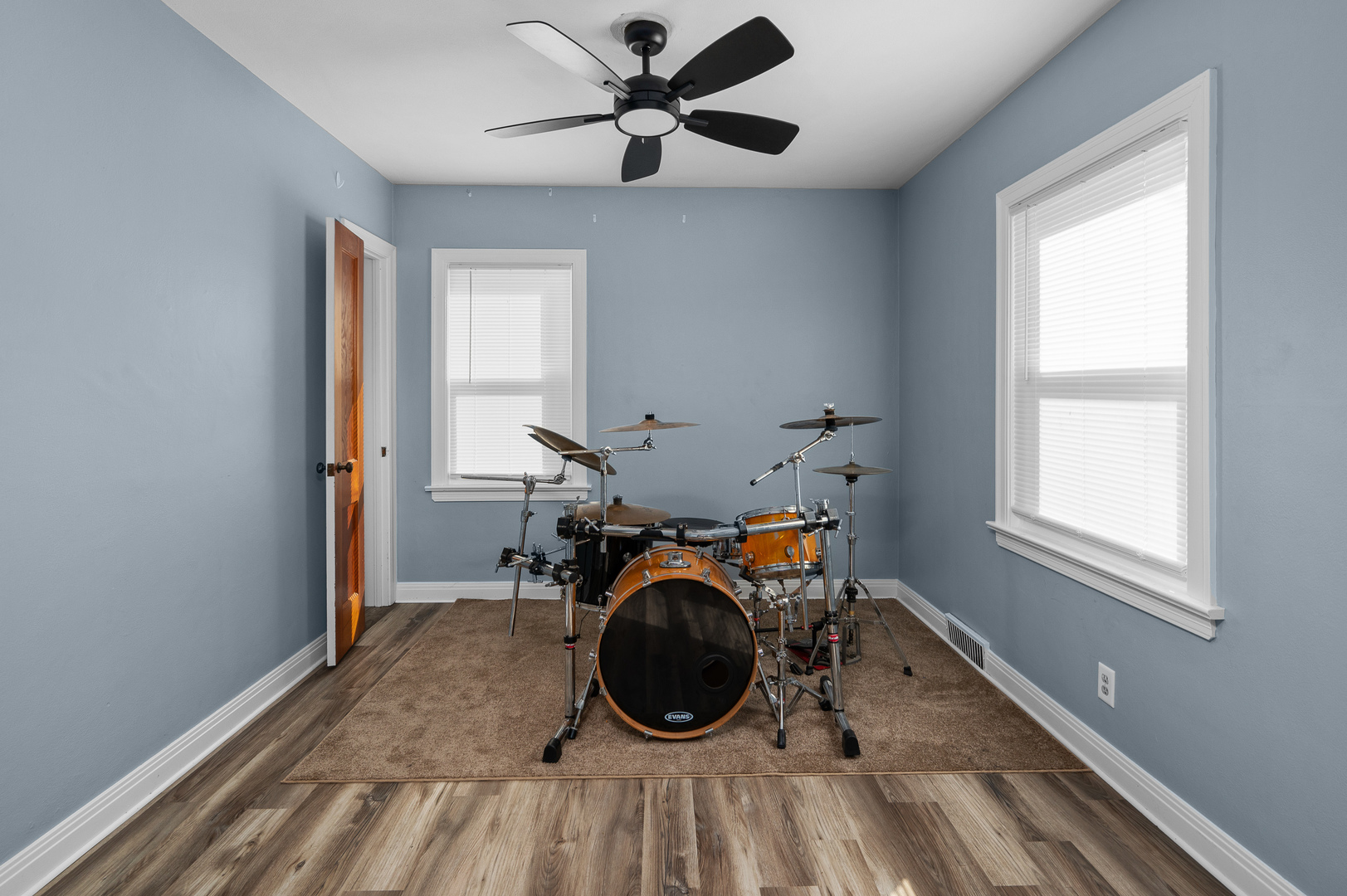 1619 20th Avenue Rock Island, IL 61201 - Photo 6 of 24 a view of a room with gym equipment and a chandelier fan
