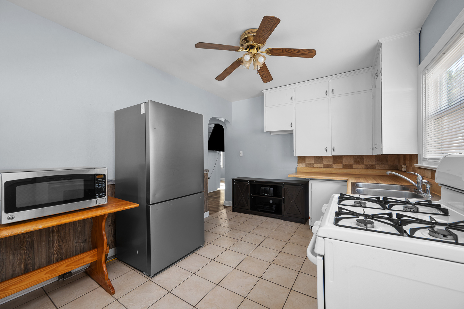 1619 20th Avenue Rock Island, IL 61201 - Photo 9 of 24 a kitchen with a refrigerator stove and microwave