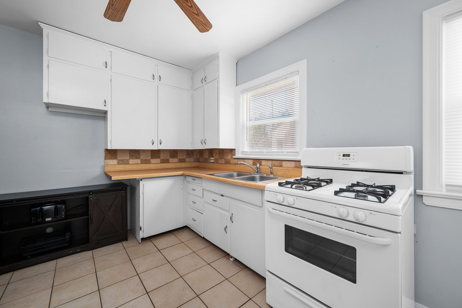1619 20th Avenue Rock Island, IL 61201 - Photo 10 of 24 a kitchen with granite countertop white cabinets and white appliances