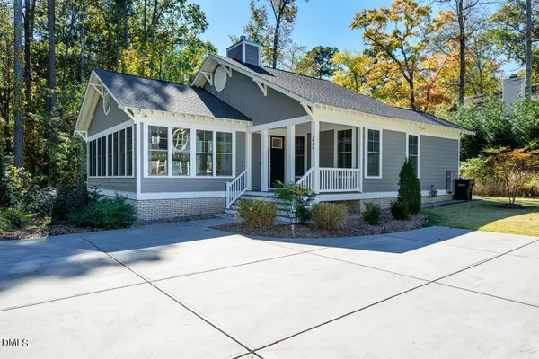 a house with trees in the background