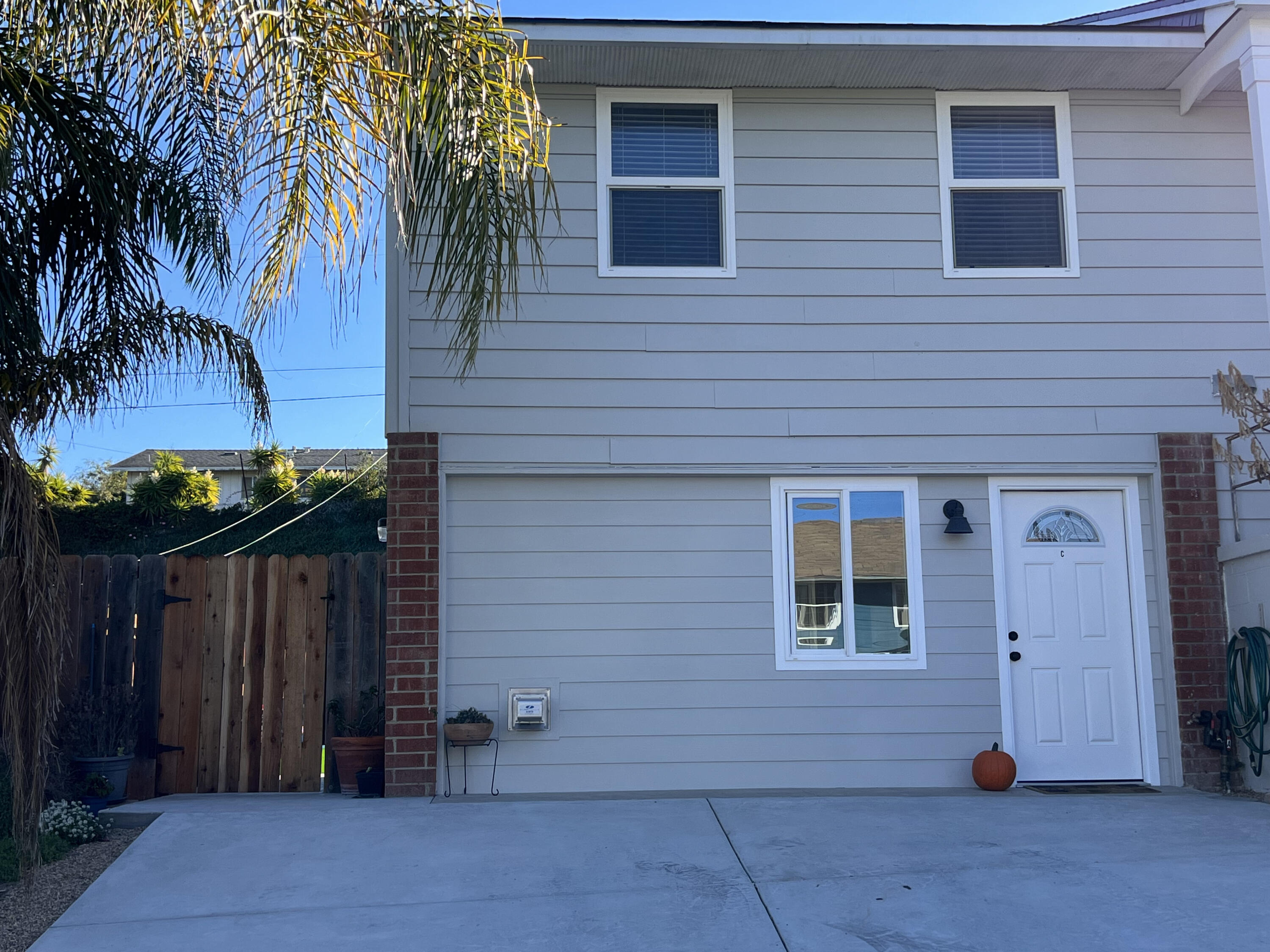 545 Sunbeam Road, Unit C Lompoc, CA 93436 - Photo 1 of 17 a couple of potted plants in front of door