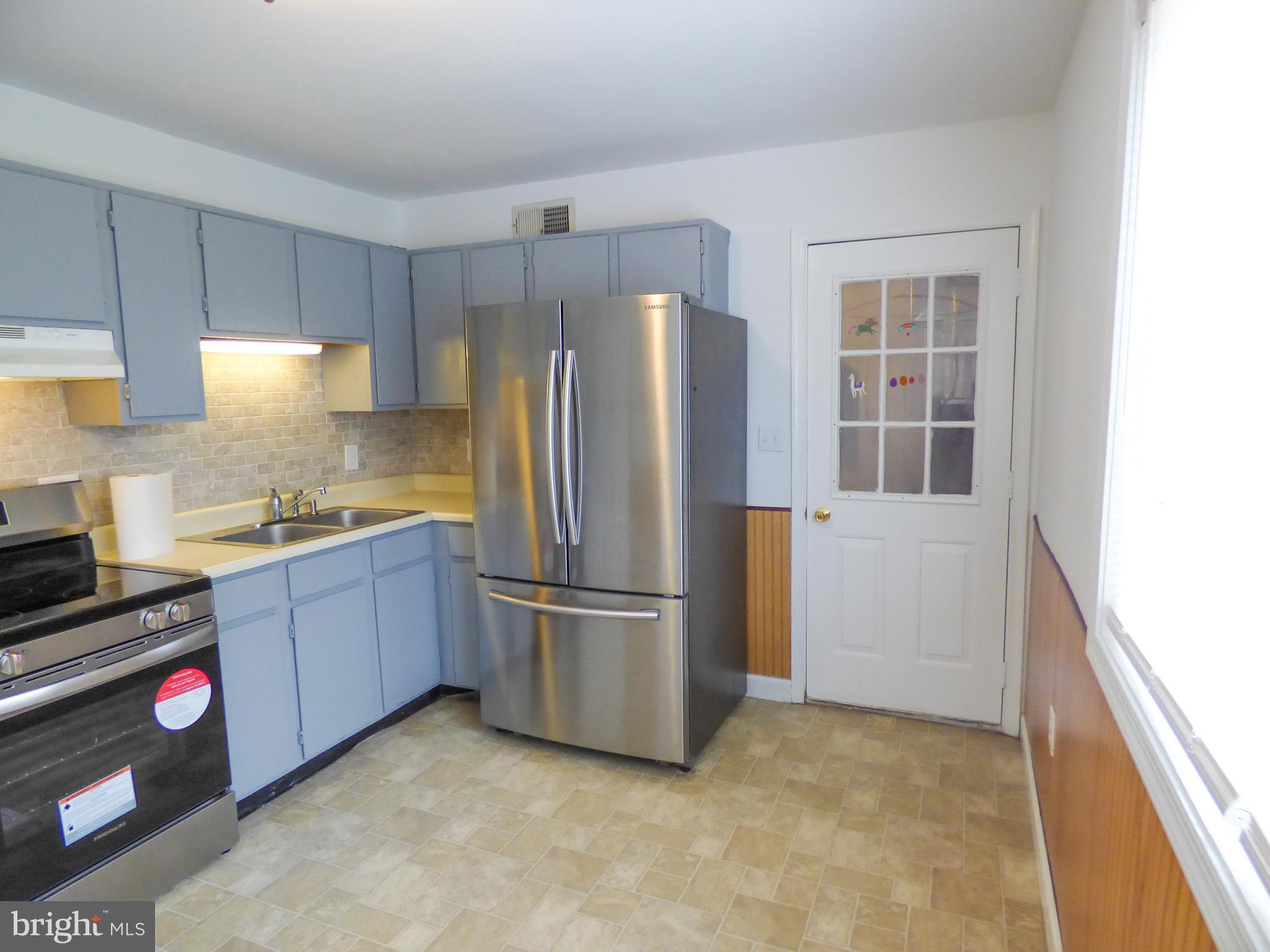 2791 Pineview Drive York, PA 17408 - Photo 9 of 23 a kitchen with stainless steel appliances a refrigerator and a stove top oven