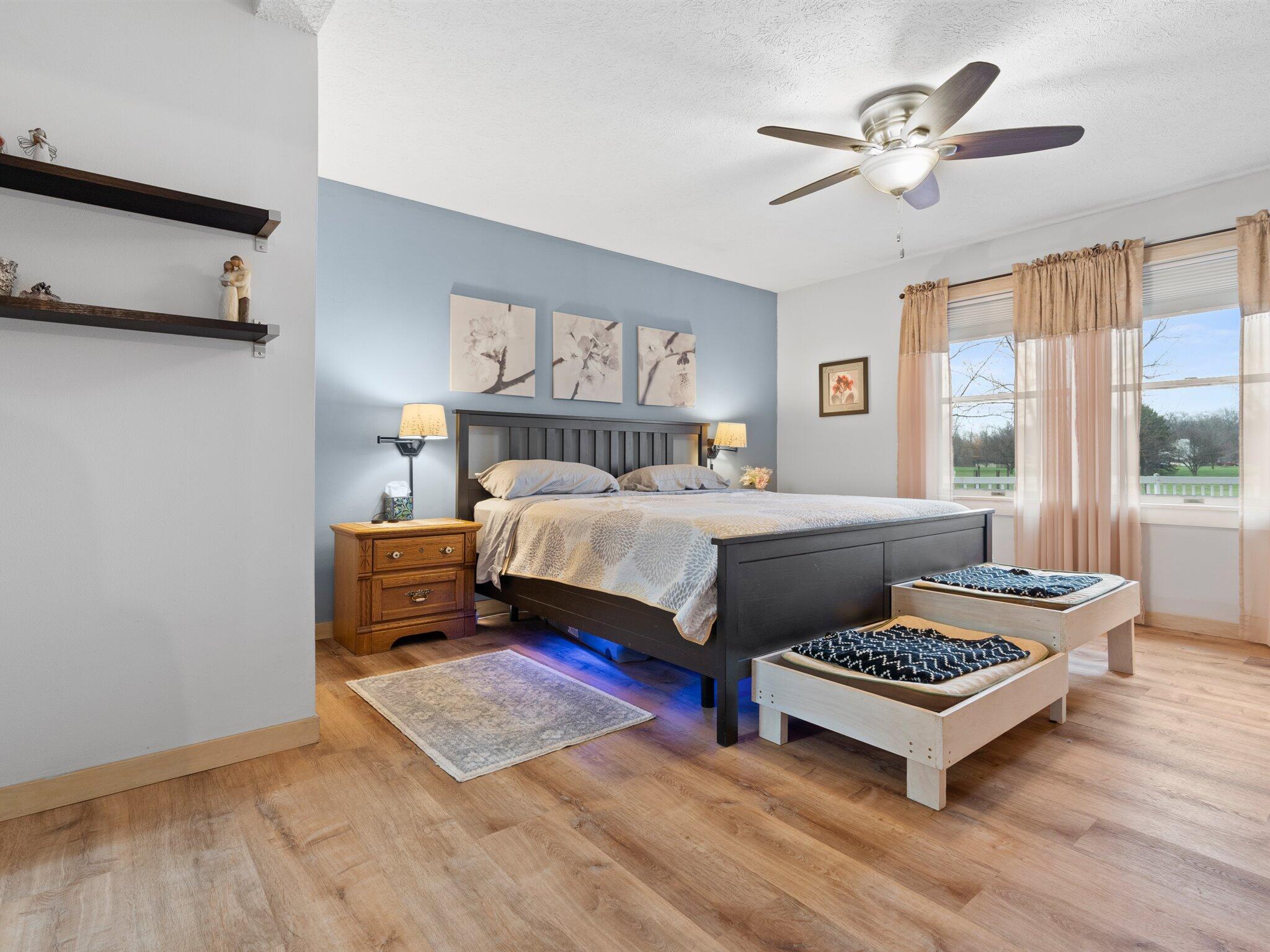 893 Pearson Road Chesterton, IN 46304 - Photo 11 of 30 a bedroom with a bed and a chandelier