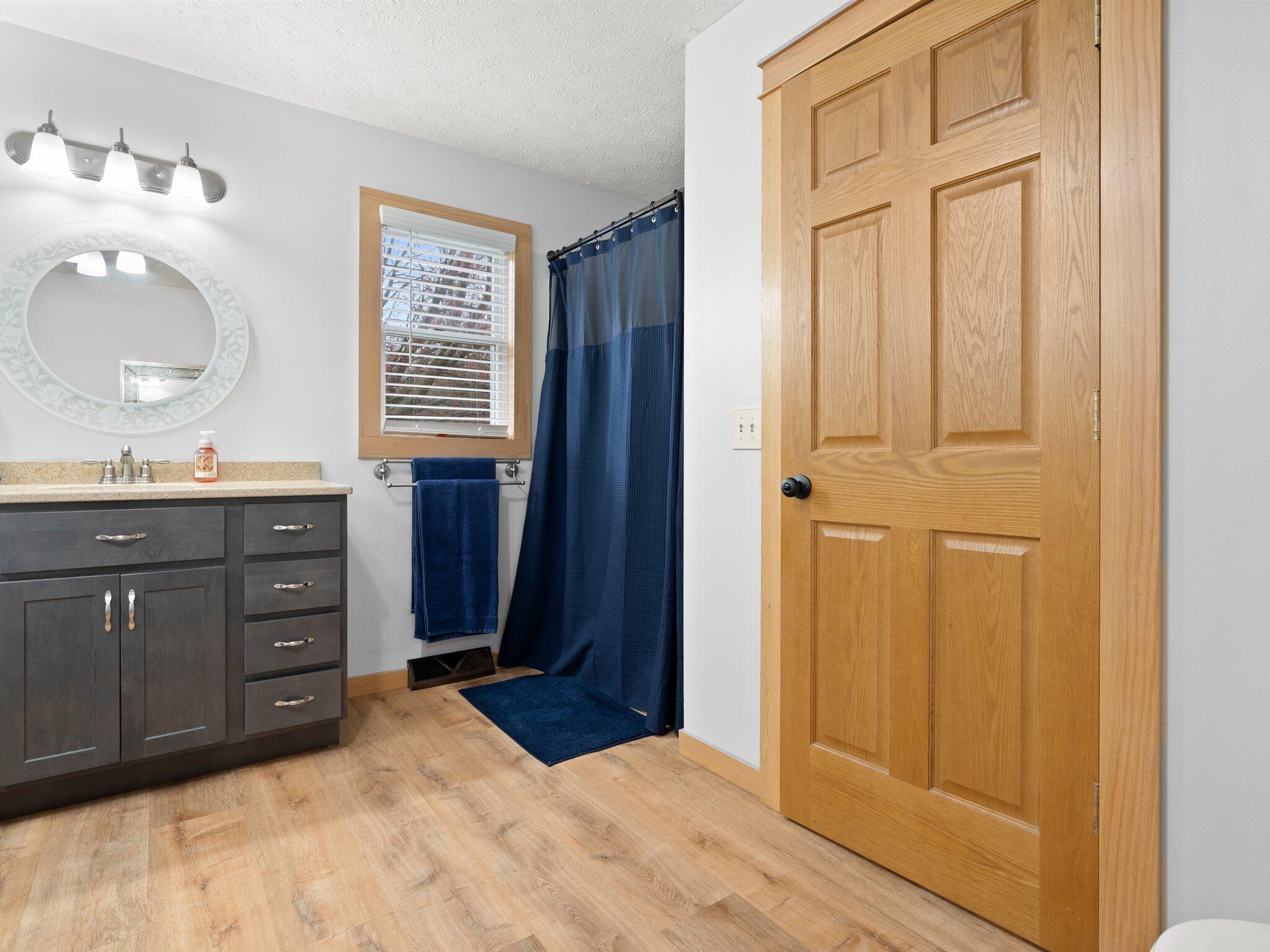 893 Pearson Road Chesterton, IN 46304 - Photo 13 of 30 a bathroom with a sink and a mirror