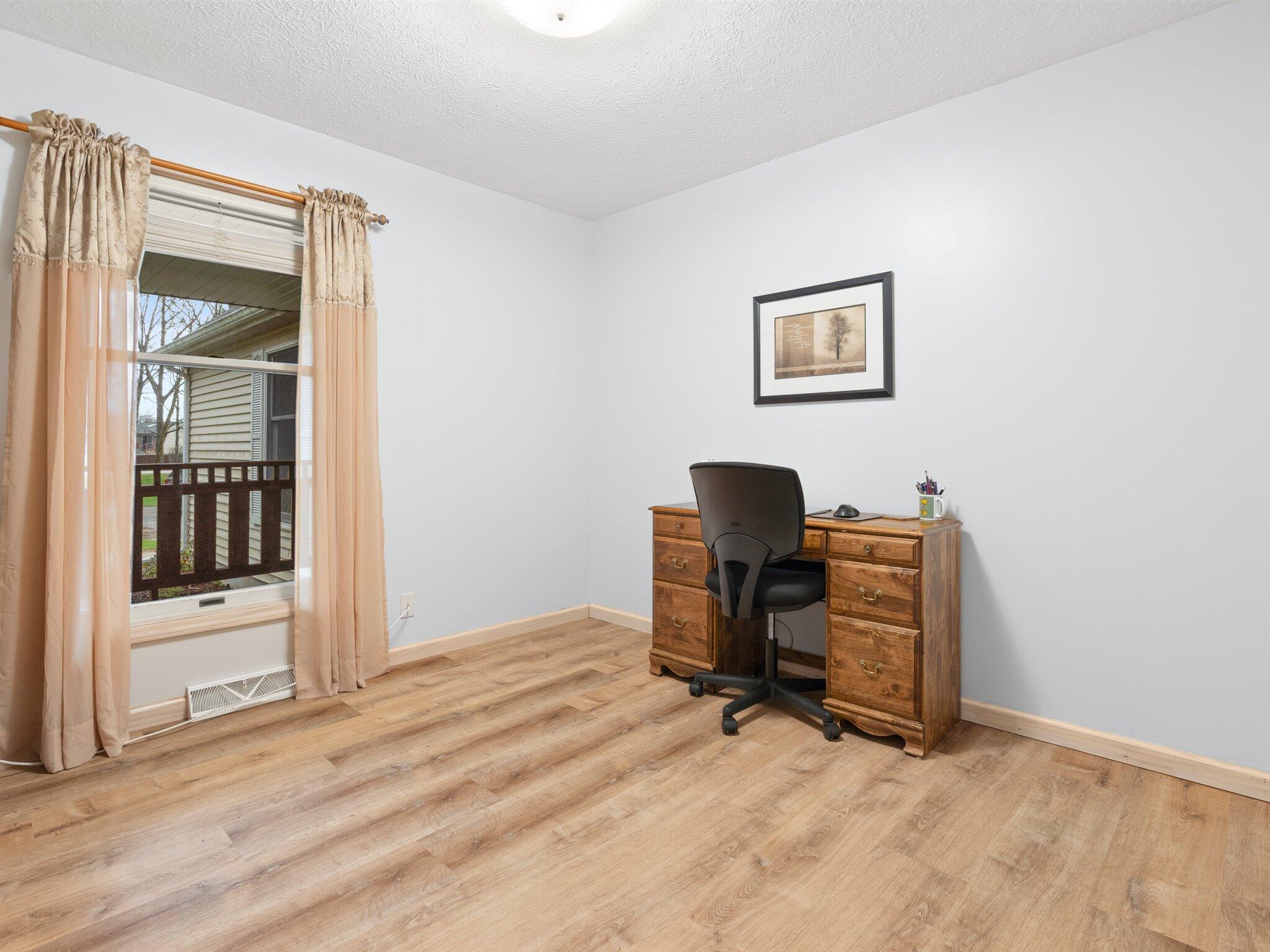 893 Pearson Road Chesterton, IN 46304 - Photo 14 of 30 a view of a workspace with furniture and a window