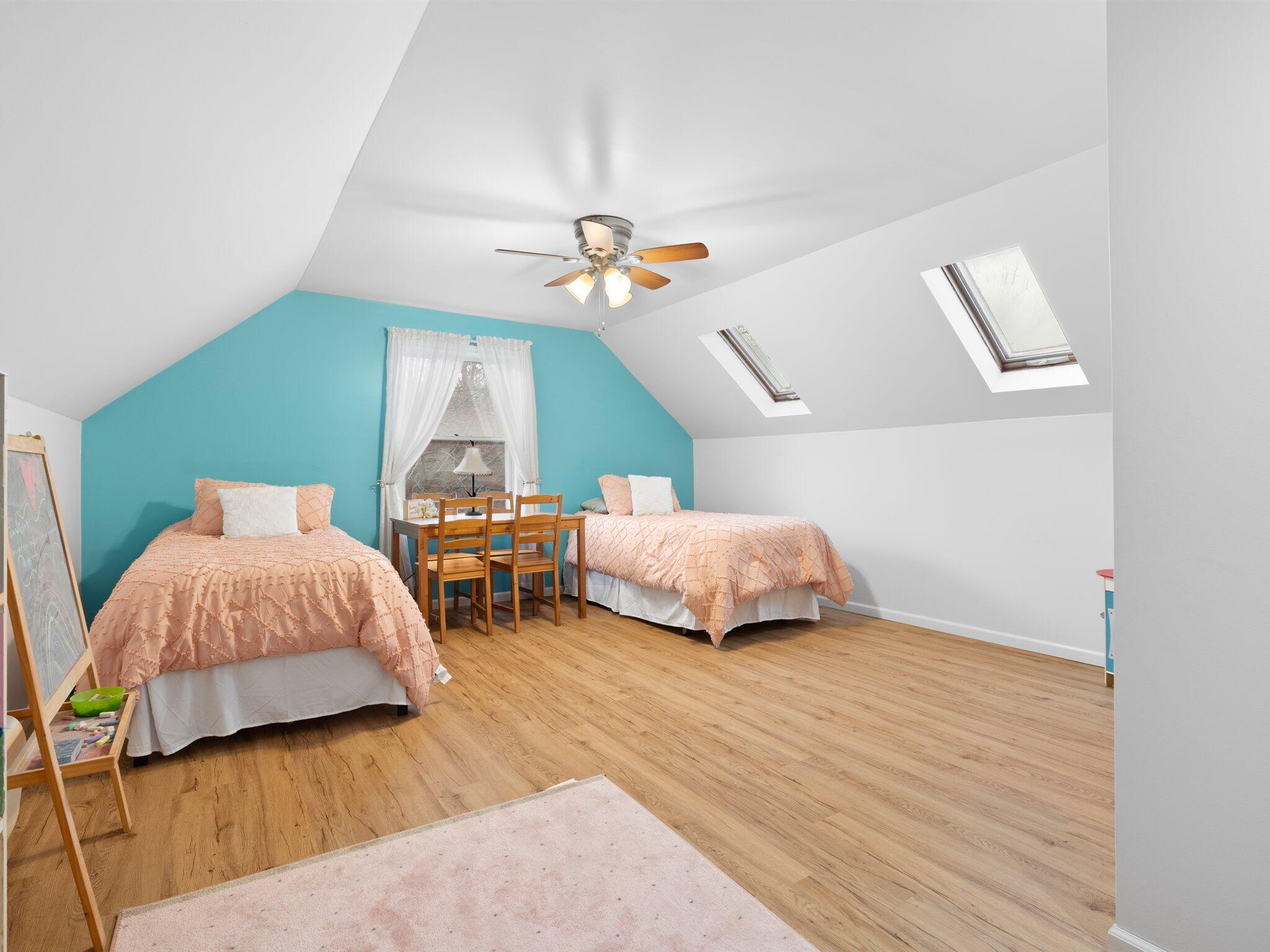 893 Pearson Road Chesterton, IN 46304 - Photo 17 of 30 a bedroom with bed and a chandelier