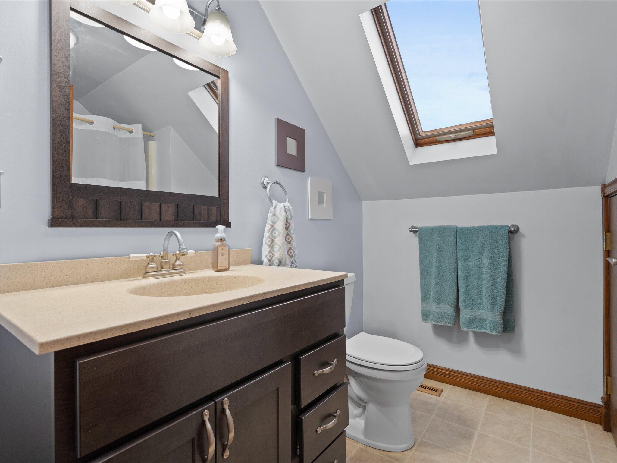 893 Pearson Road Chesterton, IN 46304 - Photo 18 of 30 a bathroom with a toilet a sink and mirror