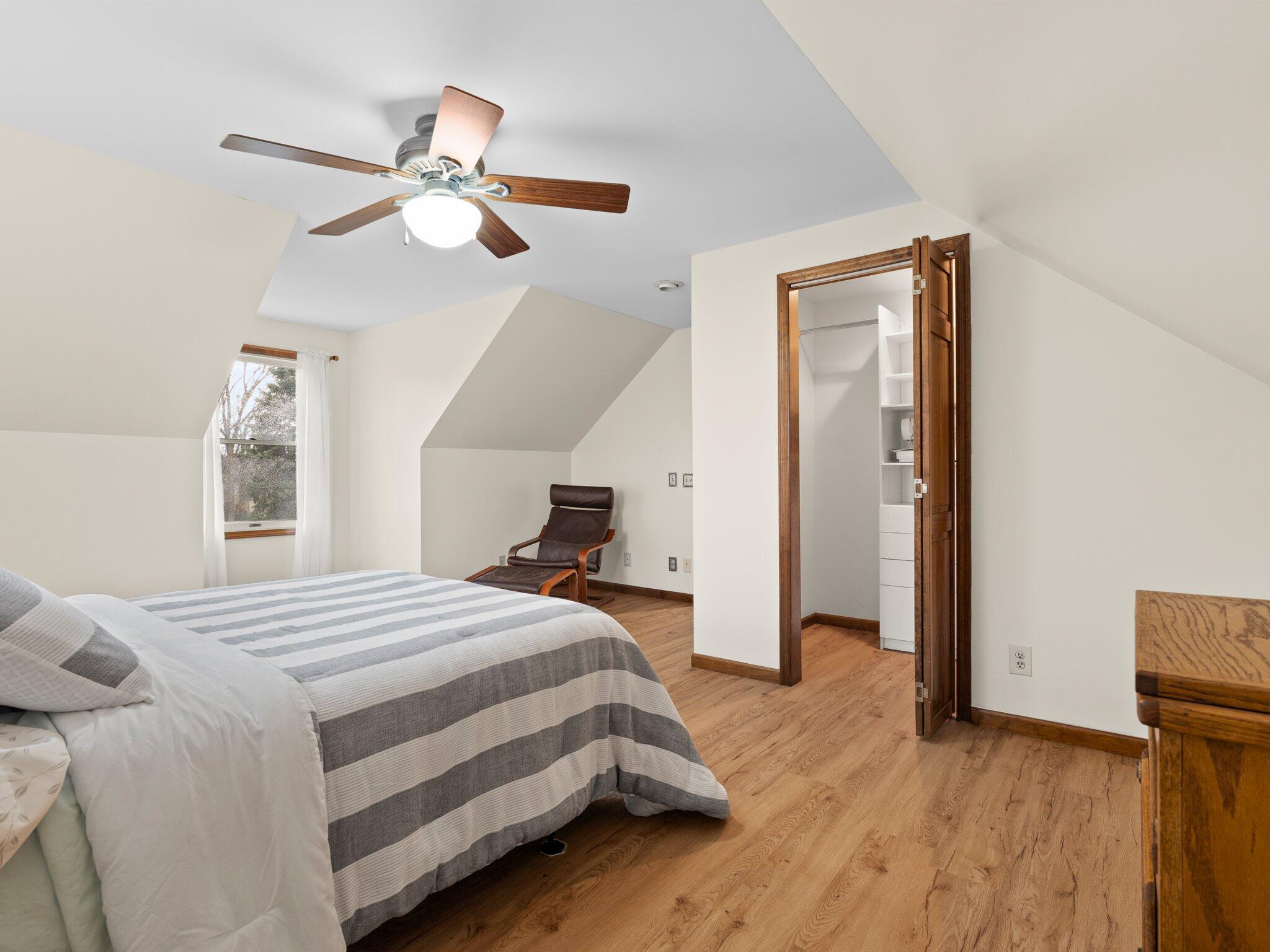 893 Pearson Road Chesterton, IN 46304 - Photo 20 of 30 a bedroom with a bed and a chandelier