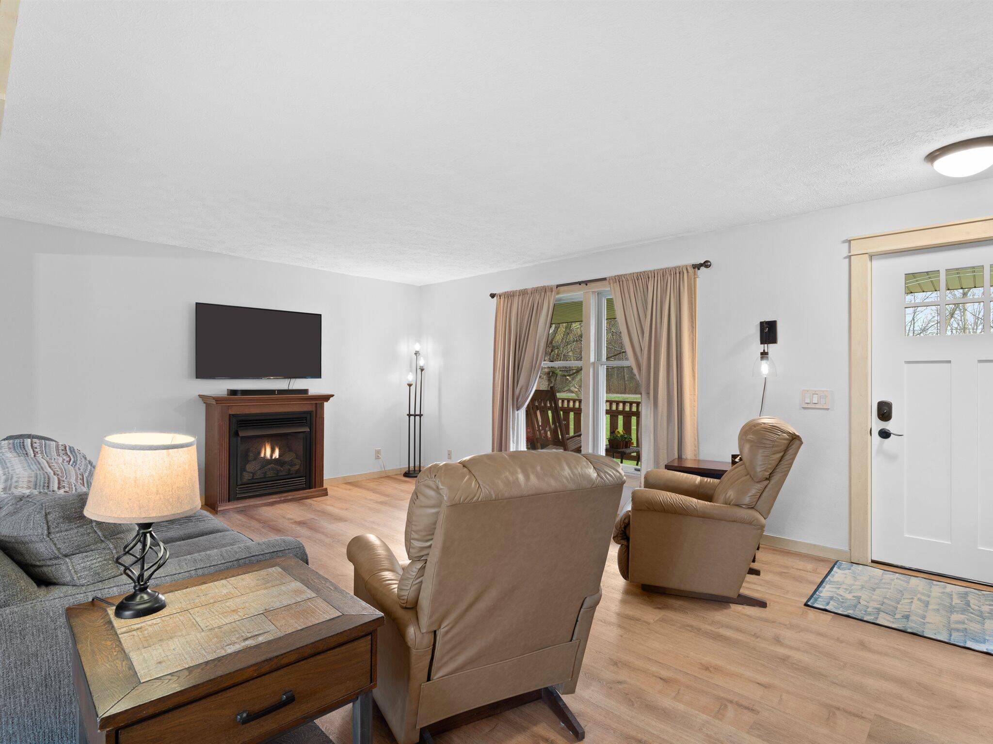 893 Pearson Road Chesterton, IN 46304 - Photo 4 of 30 a living room with furniture and a flat screen tv