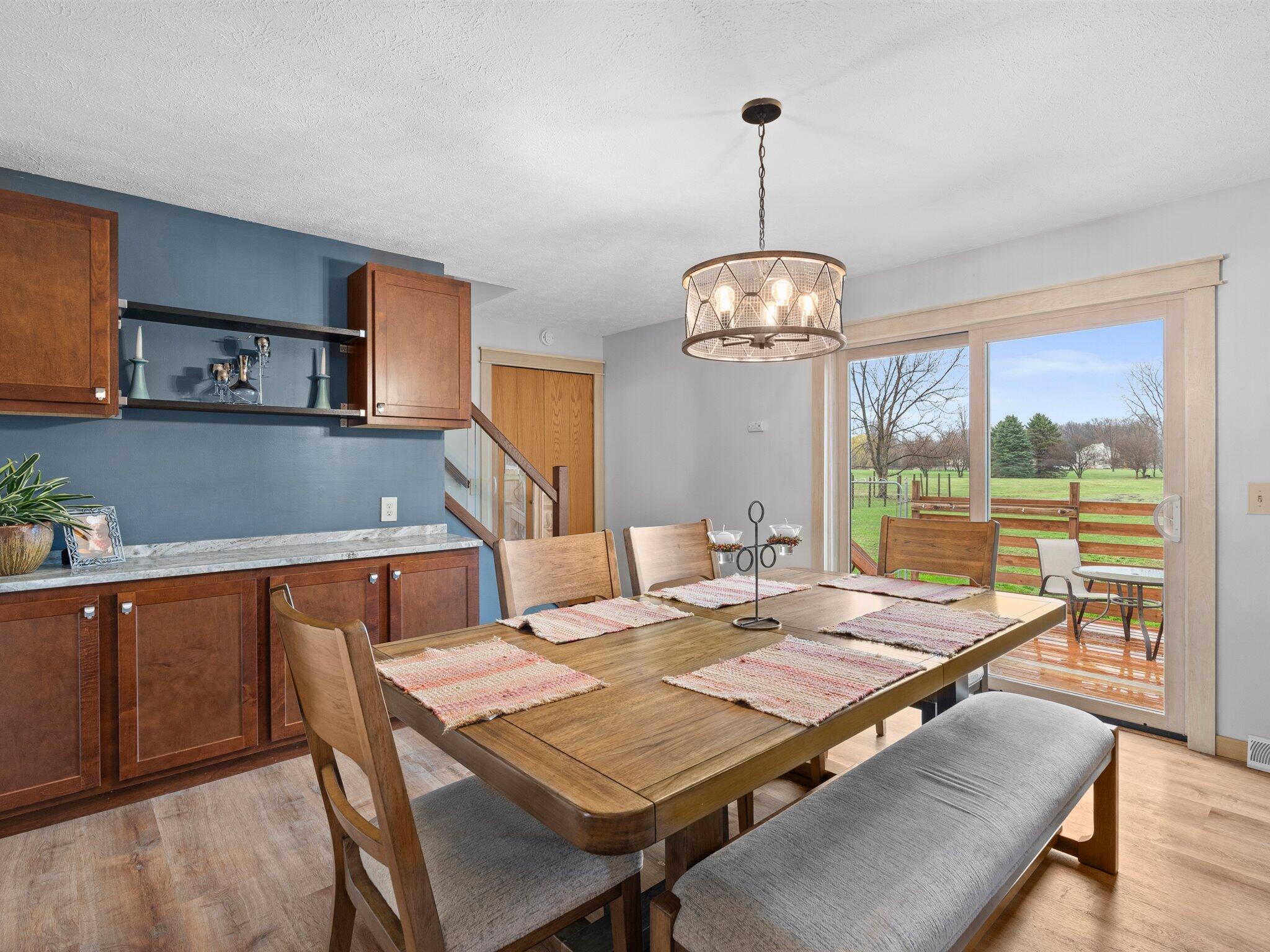 893 Pearson Road Chesterton, IN 46304 - Photo 10 of 30 a view of a dining room with furniture window and wooden floor