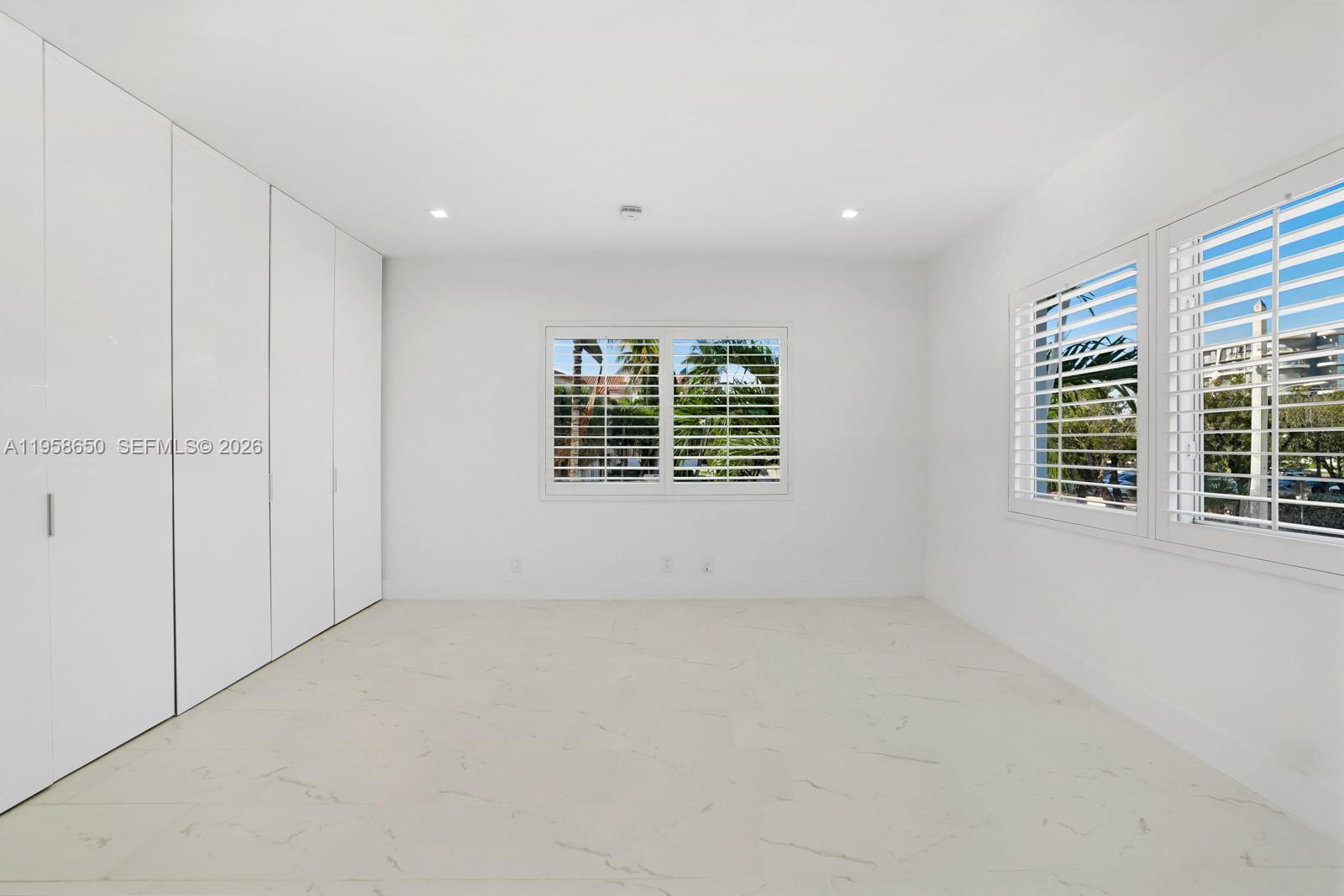 3909 Garden Avenue, Unit 4 Miami Beach, FL 33140 - Photo 13 of 29 a view of an empty room with a window