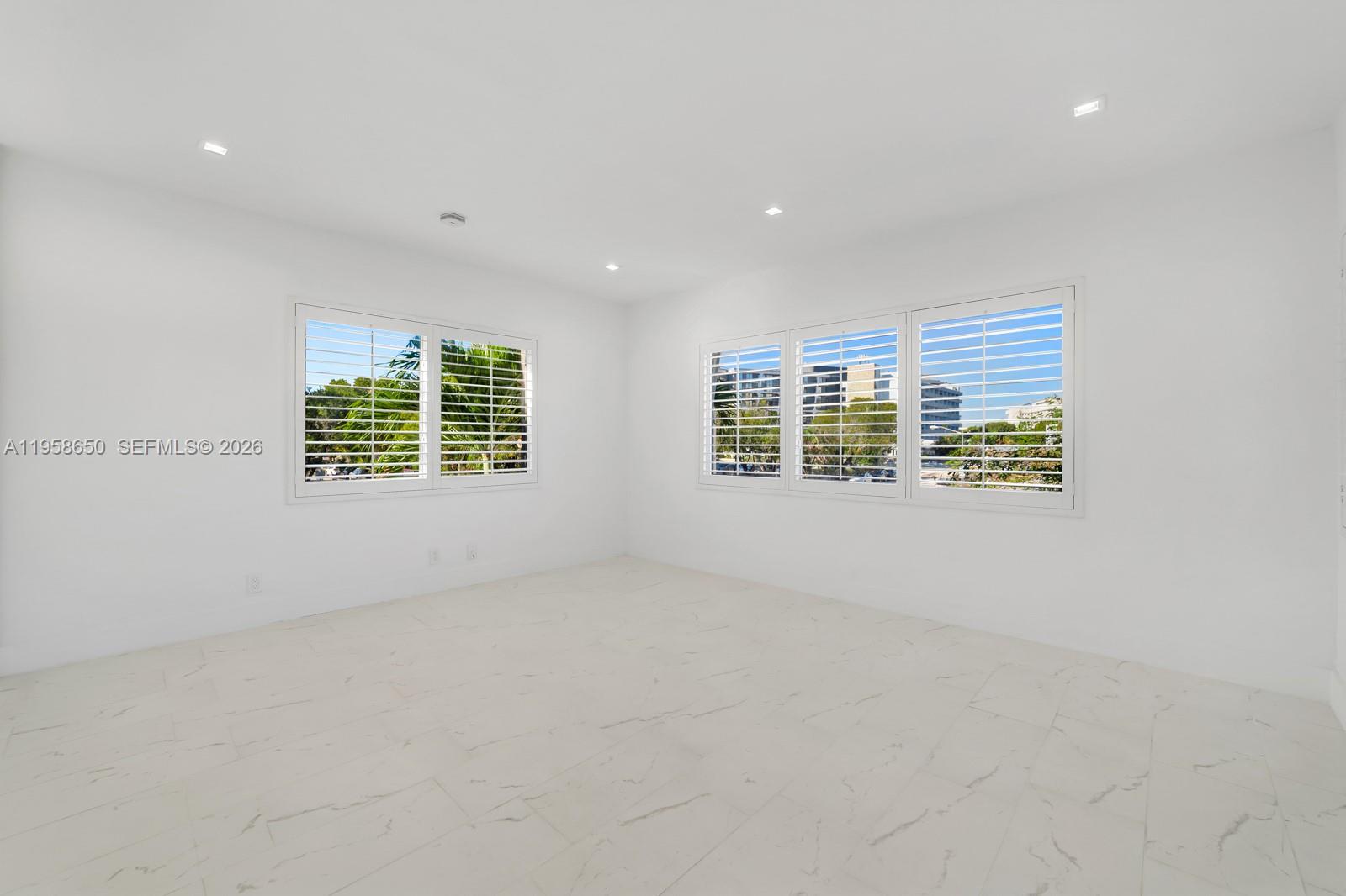 3909 Garden Avenue, Unit 4 Miami Beach, FL 33140 - Photo 14 of 29 an empty room with windows