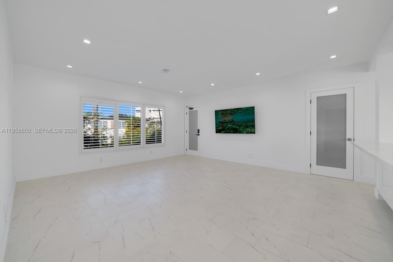 3909 Garden Avenue, Unit 4 Miami Beach, FL 33140 - Photo 6 of 29 a view of an empty room with a window