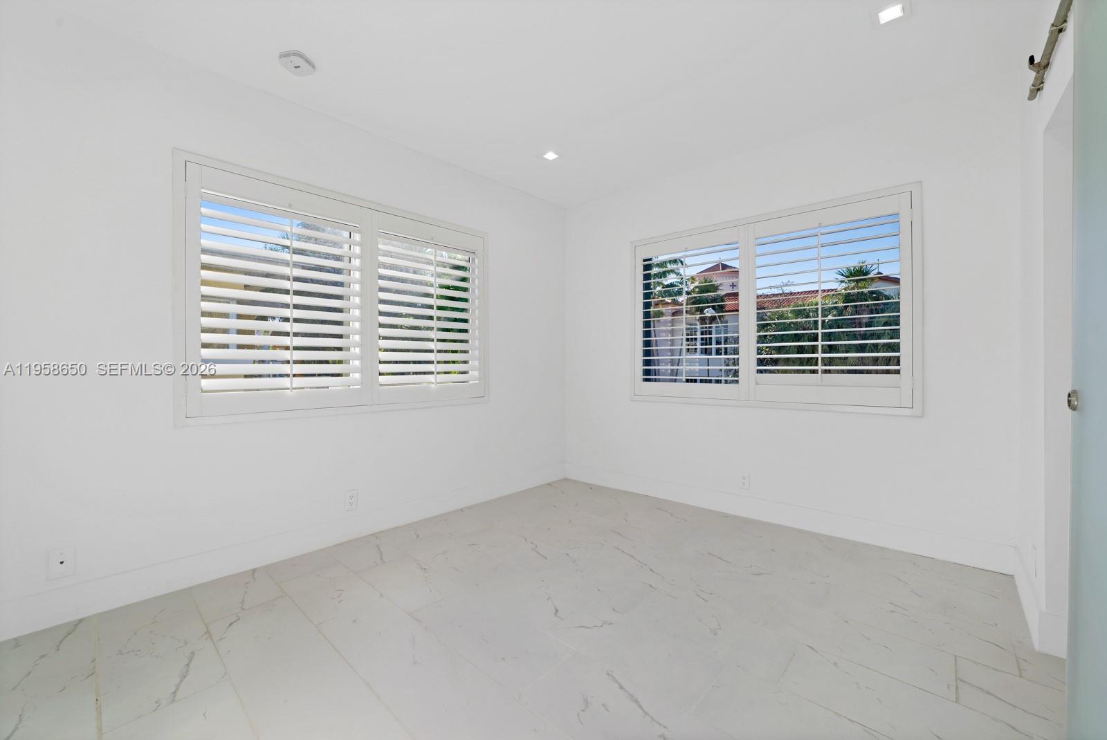 3909 Garden Avenue, Unit 4 Miami Beach, FL 33140 - Photo 9 of 29 a view of an empty room with a window