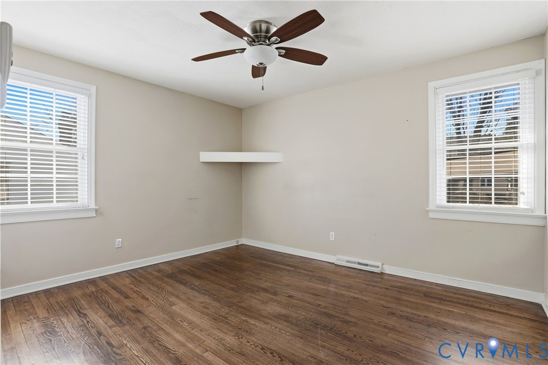 8421 Yolanda Road Henrico, VA 23229 - Photo 12 of 34 a view of a room with wooden floor and a ceiling fan