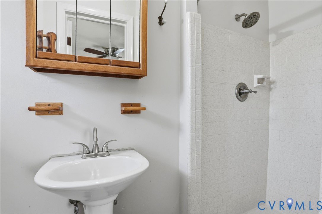 8421 Yolanda Road Henrico, VA 23229 - Photo 14 of 34 a bathroom with a sink and a mirror