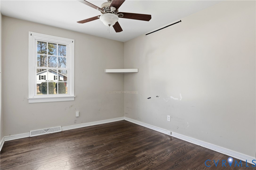 8421 Yolanda Road Henrico, VA 23229 - Photo 16 of 34 wooden floor in an empty room with a window