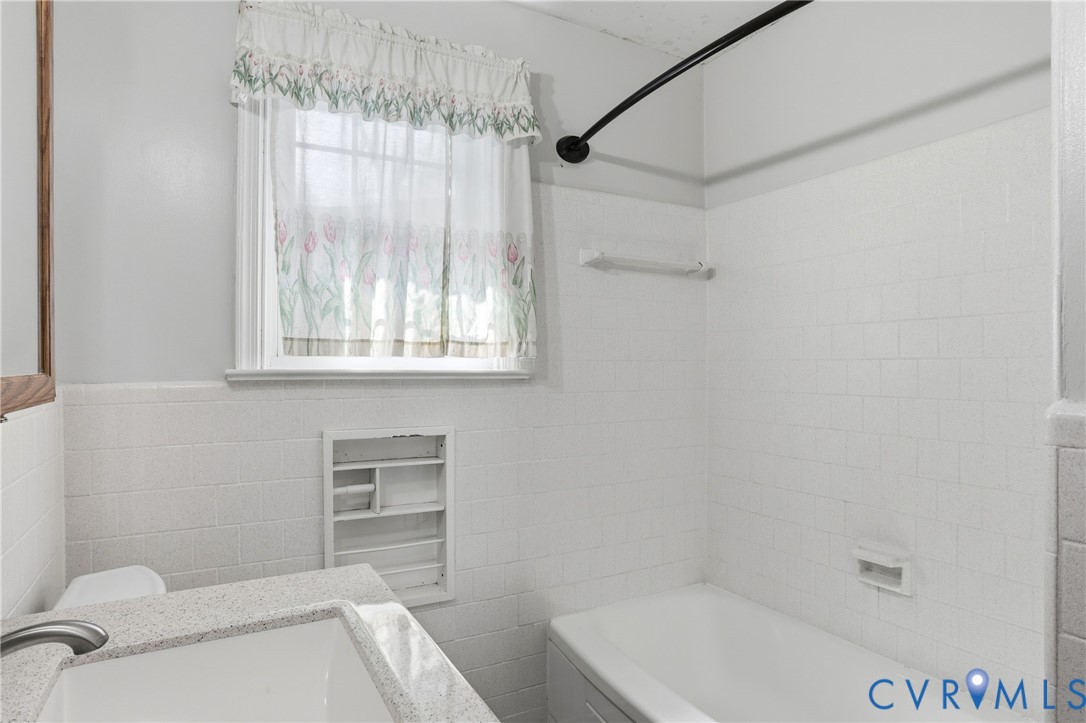 8421 Yolanda Road Henrico, VA 23229 - Photo 18 of 34 a bathroom with a sink a toilet and shower