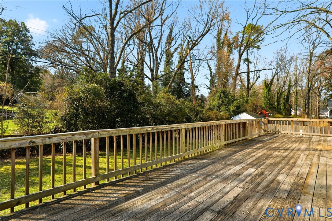 8421 Yolanda Road Henrico, VA 23229 - Photo 19 of 34 a view of balcony with wooden floor and fence