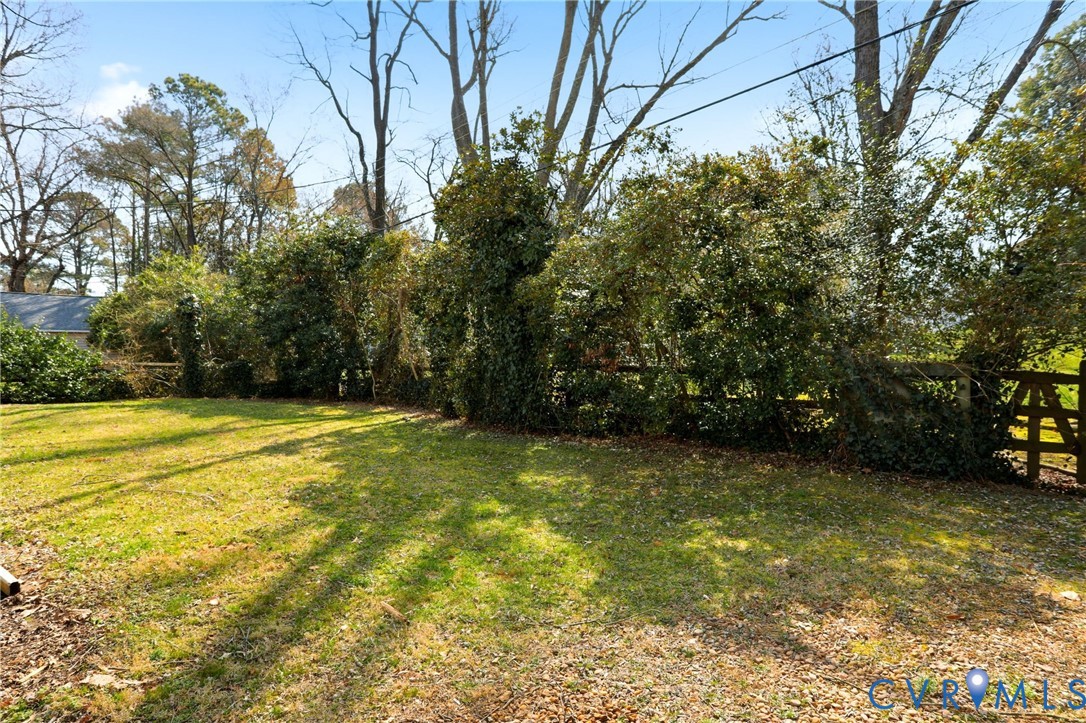 8421 Yolanda Road Henrico, VA 23229 - Photo 20 of 34 a view of a yard with an trees